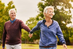 Shot of a happy senior couple going for a walk in the park
