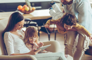 Close up of a happy young family having good time together.